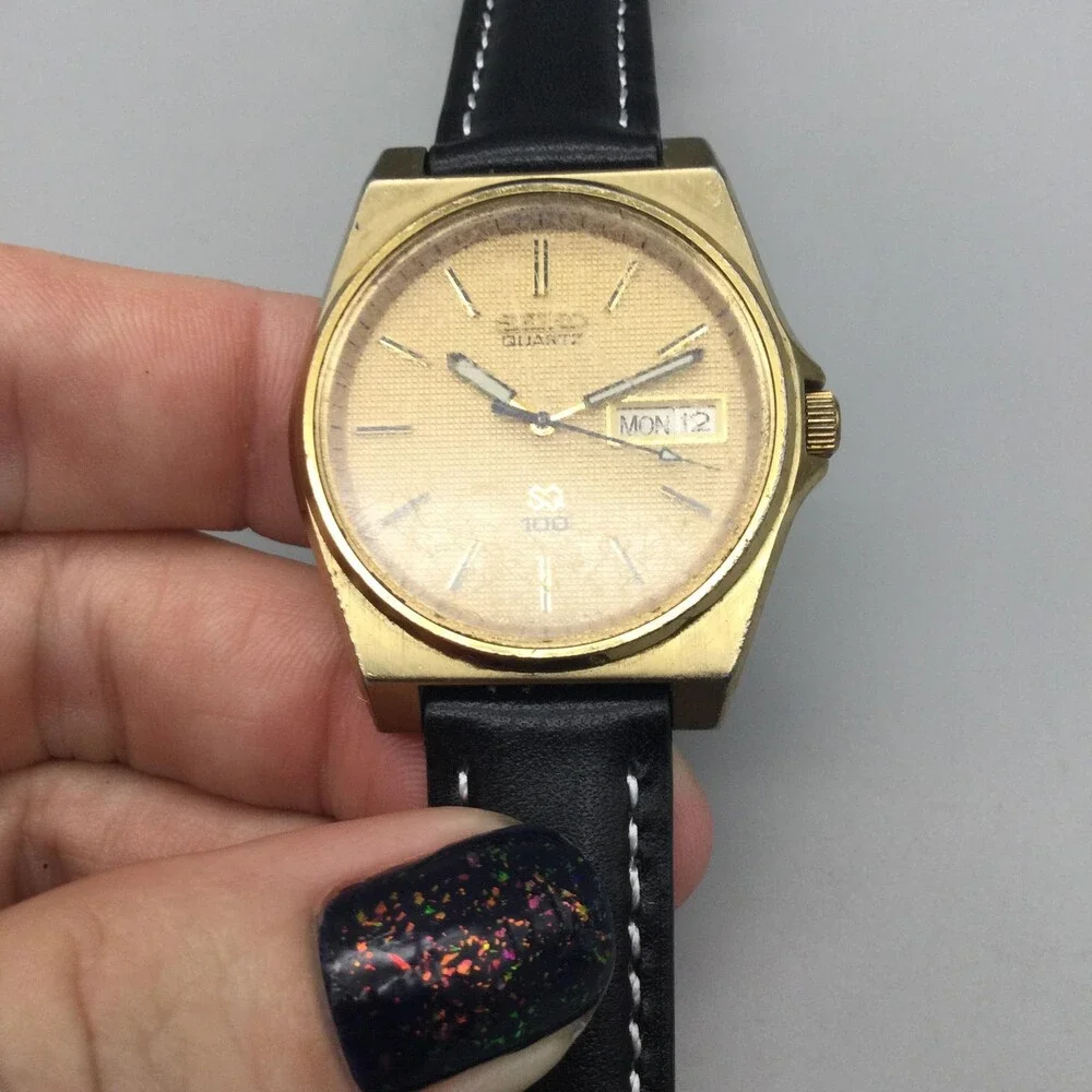Vintage Seiko SQ 100 Mens Watch 33mm Gold Tone Day Date 6923-8010 New Battery
